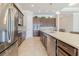 Modern kitchen with dark wood cabinets, quartz countertops, and stainless steel appliances at 277 Cyan Ave, Daytona Beach, FL 32124