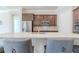 Modern kitchen island with seating and stainless steel appliances at 277 Cyan Ave, Daytona Beach, FL 32124