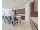 Modern kitchen with dark wood cabinets, quartz countertops, and stainless steel appliances at 277 Cyan Ave, Daytona Beach, FL 32124