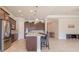 Modern kitchen with dark wood cabinets, quartz countertops, and stainless steel appliances at 277 Cyan Ave, Daytona Beach, FL 32124