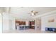 Open-concept living room and kitchen with high ceilings and a ceiling fan at 277 Cyan Ave, Daytona Beach, FL 32124