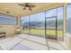 Spacious screened patio overlooking the backyard at 277 Cyan Ave, Daytona Beach, FL 32124