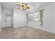 Bedroom with wood floors, ceiling fan and exterior access at 3603 Surfside Ter, Port Orange, FL 32127
