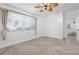 Spacious bedroom with wood floors, ceiling fan, and window coverings at 3603 Surfside Ter, Port Orange, FL 32127