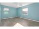 Light blue bedroom with wood floors and ceiling fan at 3603 Surfside Ter, Port Orange, FL 32127