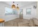 Bright dining area with herringbone floors and stylish light fixtures at 3603 Surfside Ter, Port Orange, FL 32127