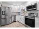 Bright kitchen featuring stainless steel appliances and granite countertops at 3603 Surfside Ter, Port Orange, FL 32127
