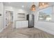 Modern kitchen with white cabinets and herringbone wood floors at 3603 Surfside Ter, Port Orange, FL 32127