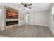 Living room featuring a modern electric fireplace and large TV at 3603 Surfside Ter, Port Orange, FL 32127
