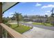 View of a quiet neighborhood street with palm trees and houses at 3603 Surfside Ter, Port Orange, FL 32127