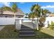 Gray composite deck stairs leading to above ground pool at 3603 Surfside Ter, Port Orange, FL 32127