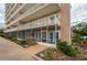 Ground-level view of a screened-in balcony or patio area at 404 S Beach St # 010 101, Daytona Beach, FL 32114
