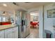 Kitchen with stainless steel appliances and a view into the adjacent dining room at 404 S Beach St # 010 101, Daytona Beach, FL 32114