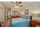 Main bedroom with ceiling fan and ensuite bathroom at 404 S Beach St # 010 101, Daytona Beach, FL 32114