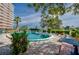 Community pool with lush landscaping at 404 S Beach St # 010 101, Daytona Beach, FL 32114