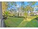 Landscaped backyard with lush greenery at 437 Harbour Town Ln, Ormond Beach, FL 32174