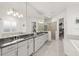 Elegant bathroom with double vanity, soaking tub, and walk-in shower at 437 Harbour Town Ln, Ormond Beach, FL 32174