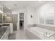 Spa-like bathroom with soaking tub, walk-in shower, and modern fixtures at 437 Harbour Town Ln, Ormond Beach, FL 32174