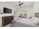 Bedroom with large TV and dresser at 437 Harbour Town Ln, Ormond Beach, FL 32174