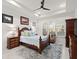 Spacious bedroom with a wooden bed frame and built-in shelving at 437 Harbour Town Ln, Ormond Beach, FL 32174