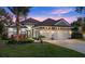 Stunning curb appeal with a three-car garage and beautifully landscaped yard at 437 Harbour Town Ln, Ormond Beach, FL 32174