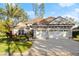Beautiful two-story house with three-car garage and manicured lawn at 437 Harbour Town Ln, Ormond Beach, FL 32174