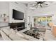 Open living space featuring a modern fireplace and built-in shelving at 437 Harbour Town Ln, Ormond Beach, FL 32174