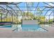 Relaxing pool area with a screened enclosure at 437 Harbour Town Ln, Ormond Beach, FL 32174