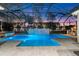 Resort-style pool with covered lanai, grilling station and outdoor seating at 437 Harbour Town Ln, Ormond Beach, FL 32174