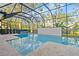 Screened pool and spa with a spacious patio at 437 Harbour Town Ln, Ormond Beach, FL 32174