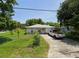 Ranch-style home with a yard and driveway at 451 Arthur Ave, Daytona Beach, FL 32114