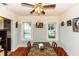 Charming dining room with hardwood floors and pool view at 5178 Riverside Dr, Port Orange, FL 32127