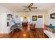 Bright living room featuring hardwood floors and a cozy seating area at 5178 Riverside Dr, Port Orange, FL 32127