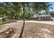 House with a large front yard and long driveway at 597 E Lansdowne Ave, Orange City, FL 32763