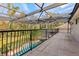 Screened balcony overlooking the pool and backyard at 973 Bearded Oaks Ter, Longwood, FL 32779
