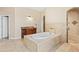 Spa-like bathroom featuring a large soaking tub and separate shower at 973 Bearded Oaks Ter, Longwood, FL 32779