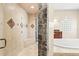 Bathroom with shower, tub, and separate water closet at 973 Bearded Oaks Ter, Longwood, FL 32779