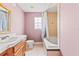 Bathroom with shower/tub combo and mauve walls at 973 Bearded Oaks Ter, Longwood, FL 32779