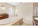 Relaxing bathroom with a large jacuzzi tub and double vanity at 973 Bearded Oaks Ter, Longwood, FL 32779