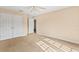Spacious bedroom with double doors and carpeting at 973 Bearded Oaks Ter, Longwood, FL 32779