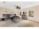 Bedroom with large windows, ceiling fan, and dresser at 973 Bearded Oaks Ter, Longwood, FL 32779