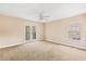 Bedroom with balcony access and ceiling fan at 973 Bearded Oaks Ter, Longwood, FL 32779