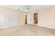 Spacious bedroom with double doors and carpet flooring at 973 Bearded Oaks Ter, Longwood, FL 32779