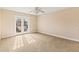 Bright bedroom with balcony access and neutral carpeting at 973 Bearded Oaks Ter, Longwood, FL 32779