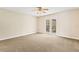 Bedroom with balcony access and ceiling fan at 973 Bearded Oaks Ter, Longwood, FL 32779