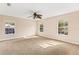 Bright bedroom with large windows and ceiling fan at 973 Bearded Oaks Ter, Longwood, FL 32779