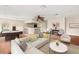 Large game room with hardwood floors, wet bar, and seating area at 973 Bearded Oaks Ter, Longwood, FL 32779