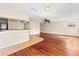 Open game room with hardwood floors and a wet bar at 973 Bearded Oaks Ter, Longwood, FL 32779