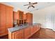 Spacious home office with built-in cabinetry and hardwood floors at 973 Bearded Oaks Ter, Longwood, FL 32779