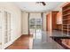 Bright home office featuring hardwood floors and a large window at 973 Bearded Oaks Ter, Longwood, FL 32779